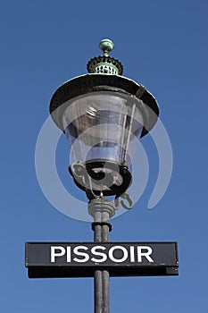 Street light with pissoir sign in Copenhagen