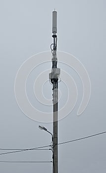 Street light pole with wires and Wireless Communication Antenna