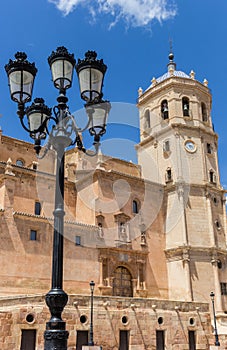 Street light and tower of the San Patricio church in Lorca photo