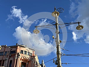 Street lights against blue sky