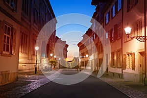 Street lights of Basel old city during sunset