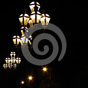 Street gas lamp post lit at night