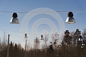 Street lights hang. street lighting. Sunny day.