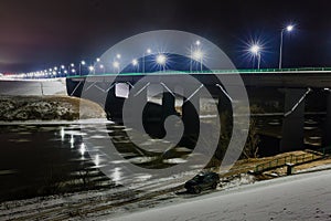 Street lights reflected on the water surface and night landscape