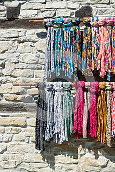 Street market of scarves and stone wall, Plovdiv