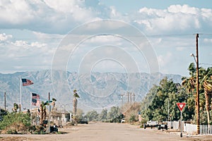 A street and mountains in Bombay Beach, on the Salton Sea in California