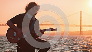 Street musician playing electric guitar in the street