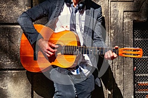 Street musician playing guitar. Close up. Music and  freedom concept