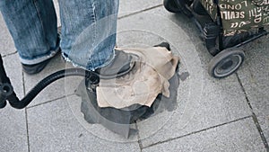 A street musician plays the bagpipes with a foot drive. Cool footage.