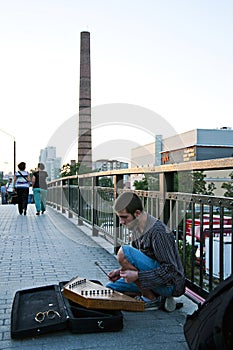 Street musician plays santoor aka hammered dulcimer