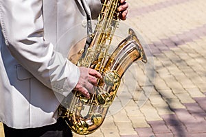 Street musician, saxophone.