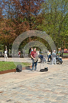 Street musician saxophonist playing at Kants island