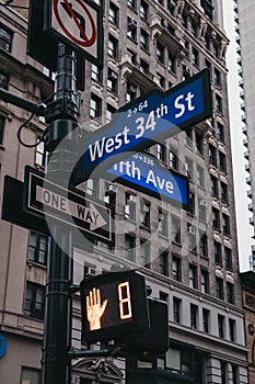 Street name and road signs on the corner Fifth Avenue and West 3