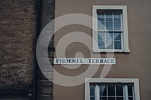 Street name sign on a building on Phoenix Terrace in Frome, UK