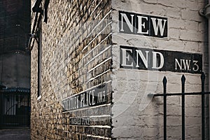 Street name sign on the corner of New End and Streatley Place, H