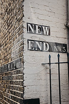 Street name sign on the corner of New End and Streatley Place, H