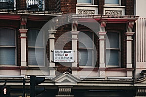 Street name sign in English and Chinese on Shaftesbury Avenue in Chinatown, London, UK