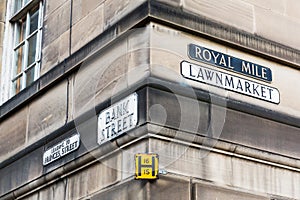 Street name signs at a house wall in Edinburgh