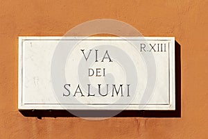 Street name via del salumi - engl: sausage street - painted at the wall in Rome photo