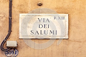 Street name via del salumi - engl: sausage street - painted at the wall in Rome photo