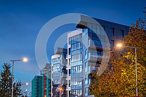 Street with new apartments at dusk in Poland