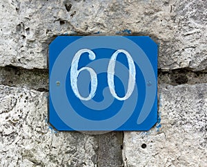 Street Number 60 on a Stone Wall