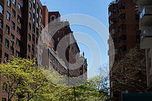 Street with Old Buildings and Skyscrapers in Midtown Manhattan of New York City