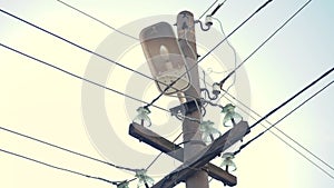 Street old lamp with wires and electricity. lamppost for street lighting close-up. lamp in the lantern on the pole