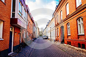 Street with old nice colorful houses in historical center of Malmo