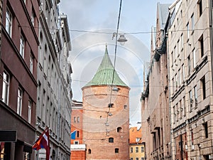 street of the old rica (vecriga) in latvia with a focus on the Riga powder tower, also called pulvertornis. It\'s a