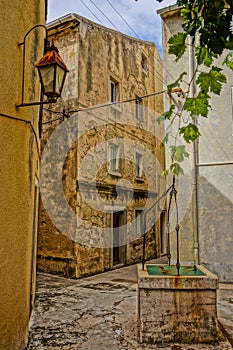 street in an old town with drawing well and lantern. HDR-Picture
