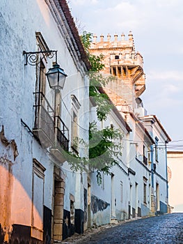 Street in the Old Town of Estremoz, Portugal. Three Crowns tower