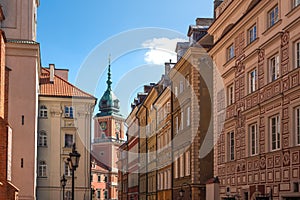 Street in old town with Royal Castle Clock Tower - Warsaw, Poland