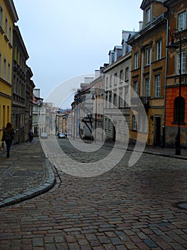 Street in old town of Warsaw, Poland. Cloudy day.