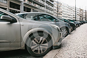 Street parking with cars in Lisbon, Portugal. Cars parked on street.