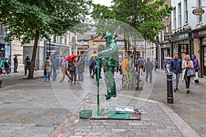 Street performer outside Covent Garden, London