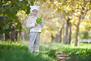 Street portrait of the child playing in the park