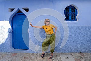 Street portrait of a funny pretty woman in blue city of  Chefchaouen,Morocco