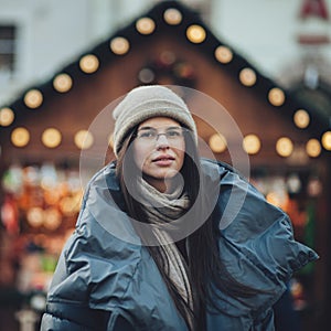 Street portrait of smiling beautiful young woman Model looking a