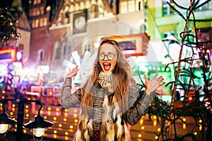 Street portrait of young woman on the festive Christma