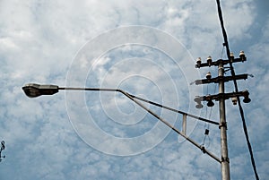 street powerline againsts cloudy sky