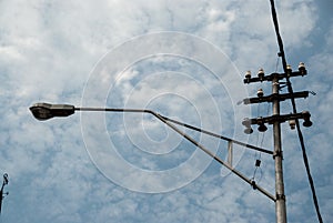 Street powerline againsts cloudy sky