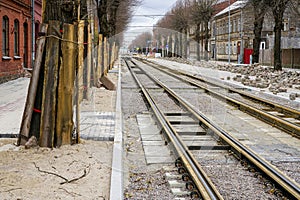 Street reconstruction, tree trunks with board protectors, newly replaced tram tracks and pavement