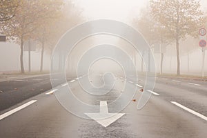 Street with reduced visibility due to fog photo