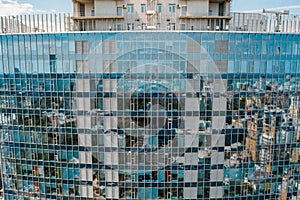 Street reflection on glass steel building facade