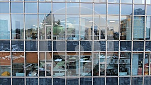 Street reflection on glass steel building facade