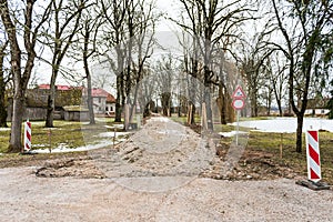 Street repair in winter. Road signs Road works and No vehicles