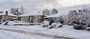 Street of residential houses in suburban. Family houses in snow on winter season