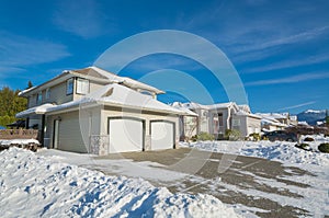 Street of residential houses on winter sunny day