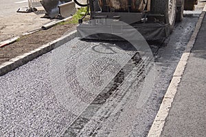 Street resurfacing with fresh asphalt construction